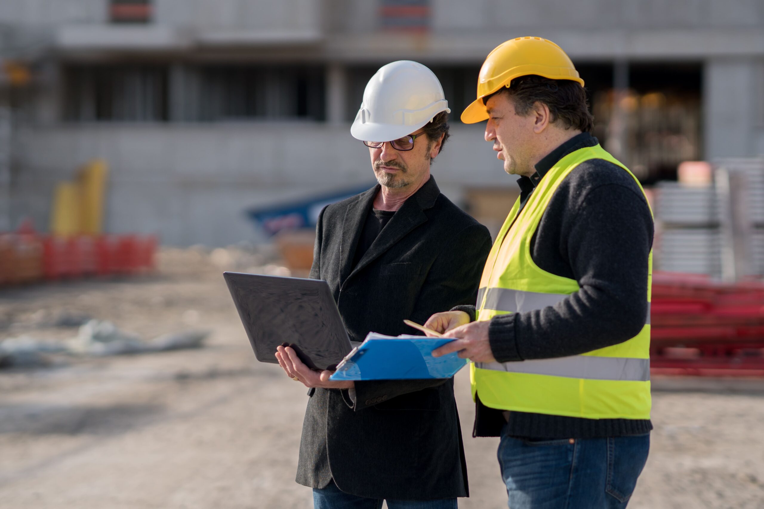 engineer-discussing-with-construction-worker-site (1)